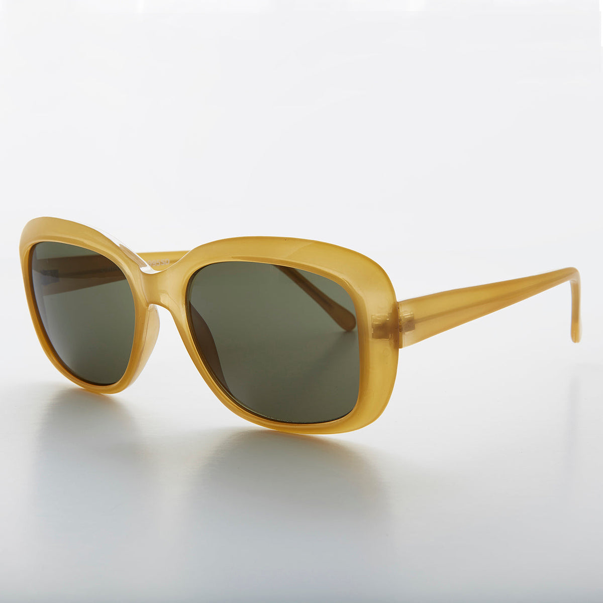 Green square vintage women's sunglasses by Sunglass Museum, retro style with classic design and tinted lenses.
