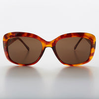 Green square retro vintage women's sunglasses by Sunglass Museum featuring classic design and stylish frame.