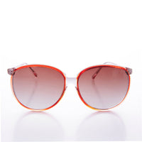 Round large women's 80s vintage sunglasses by Sunglass Museum with bold frames and dark lenses.