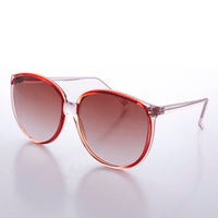 Large round women's vintage sunglasses by Sunglass Museum featuring retro 80s style with dark tinted lenses