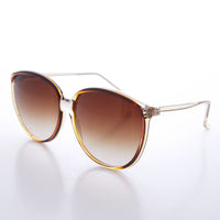 Round large women's 80s vintage sunglasses by Sunglass Museum, featuring bold frames and retro style.