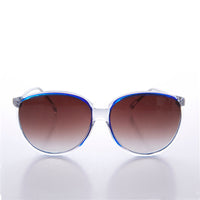 Large round 80s vintage women's sunglasses by Sunglass Museum, with bold frames and retro style.