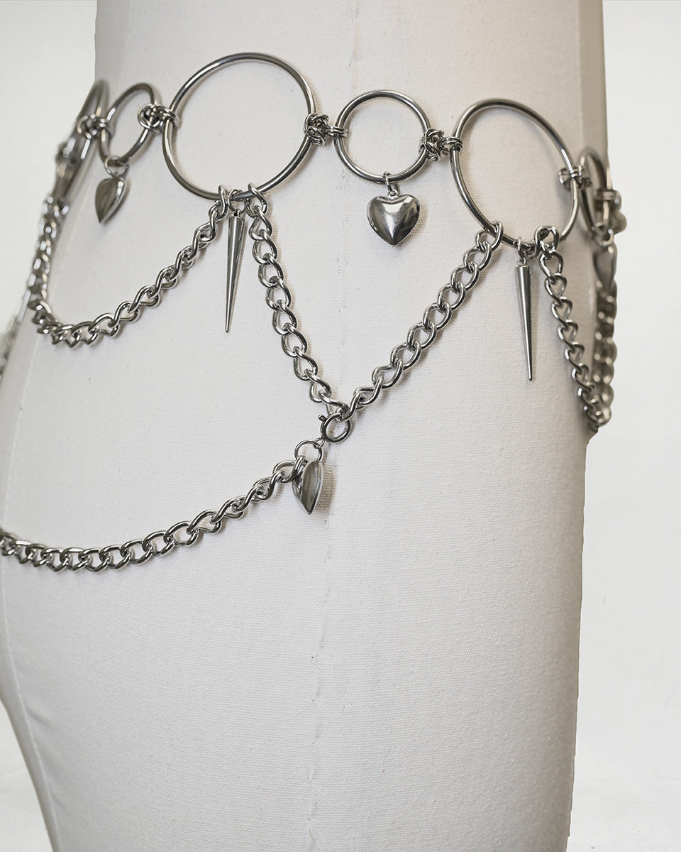 Silver Heartbreaker Waist Chain Belt by SUSPEX Rave Outfits, featuring Y2K-inspired body jewelry design and chain details.