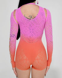 Sunset Rebel romper jumpsuit by SUSPEX Rave Outfits featuring a vibrant sunset design and stylish one-size fit.