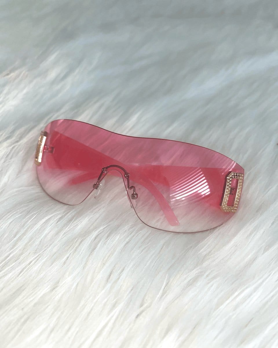 Neon pink shield sunglasses by SUSPEX Rave Outfits, featuring bold, oversized UV-protective lenses and a stylish shield design.