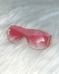 Neon pink shield sunglasses by SUSPEX Rave Outfits, featuring bold, oversized UV-protective lenses and a stylish shield design.