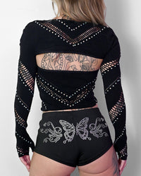 Black halter bolero top with cutout details from SUSPEX Rave Outfits, perfect for festival or rave fashion looks.