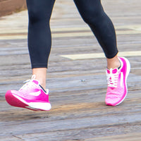 Pink APUS Women athletic shoes by Swift Running, featuring breathable mesh and cushioned sole for comfortable active wear.