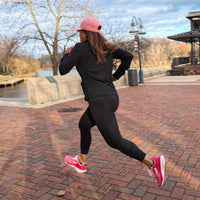 Pink Swift Running APUS women’s athletic shoes with breathable mesh upper and cushioned sole for comfortable running.