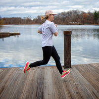 Pink Swift Running athletic shoes for women from Equus, featuring a sleek design and comfortable fit.