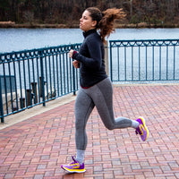 Swift Running EQUUS Women athletic shoes in purple, showing the side view with breathable mesh and cushioned sole.