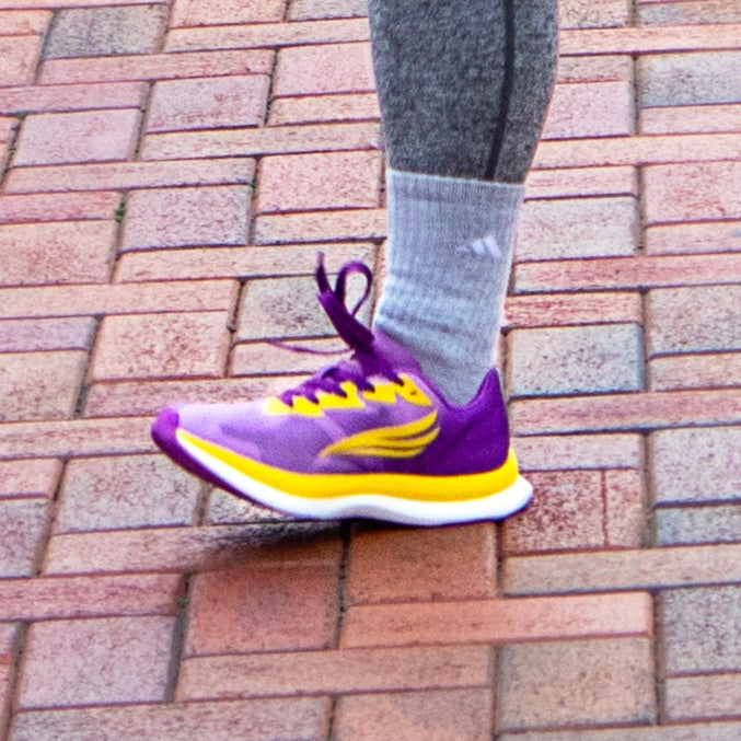 Swift Running Equus Women athletic shoes in purple with a sleek design, suitable for running and active wear.