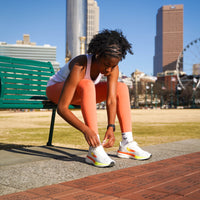 Swift Running APUS Women athletic shoes in white, showcasing lightweight design and breathable fabric for active wear.