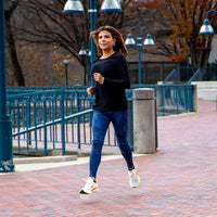 White APUS Women athletic shoes by Swift Running featuring a sleek design and comfortable fit for active wear.