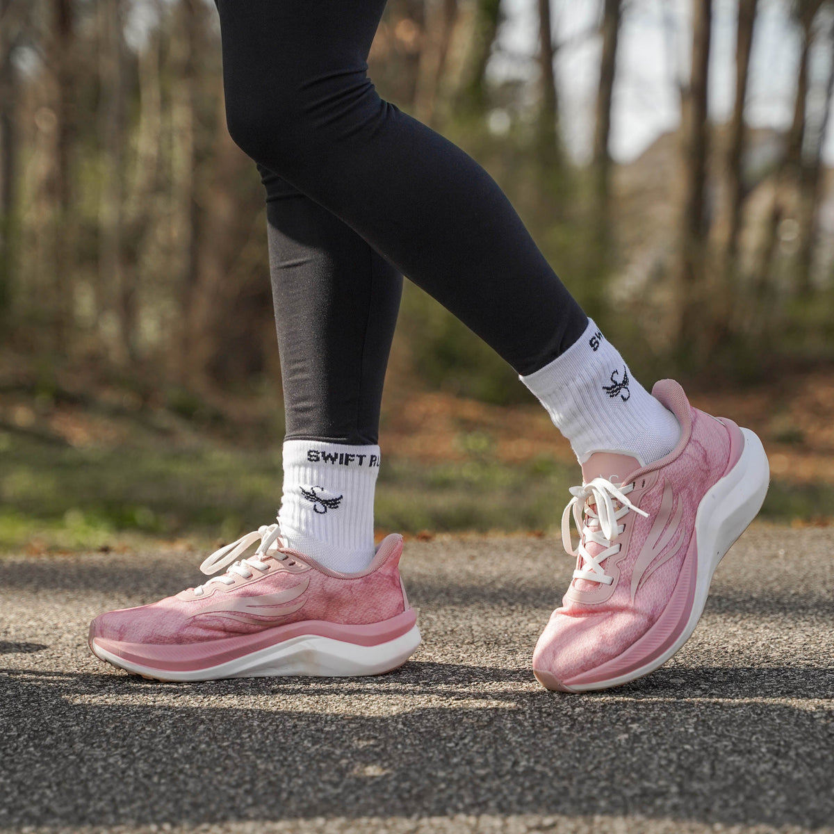 Pink CELER Women athletic shoes by Swift Running with breathable mesh design and cushioned soles for comfortable active wear.