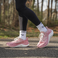 Pink CELER Women athletic shoes by Swift Running with breathable mesh design and cushioned soles for comfortable active wear.