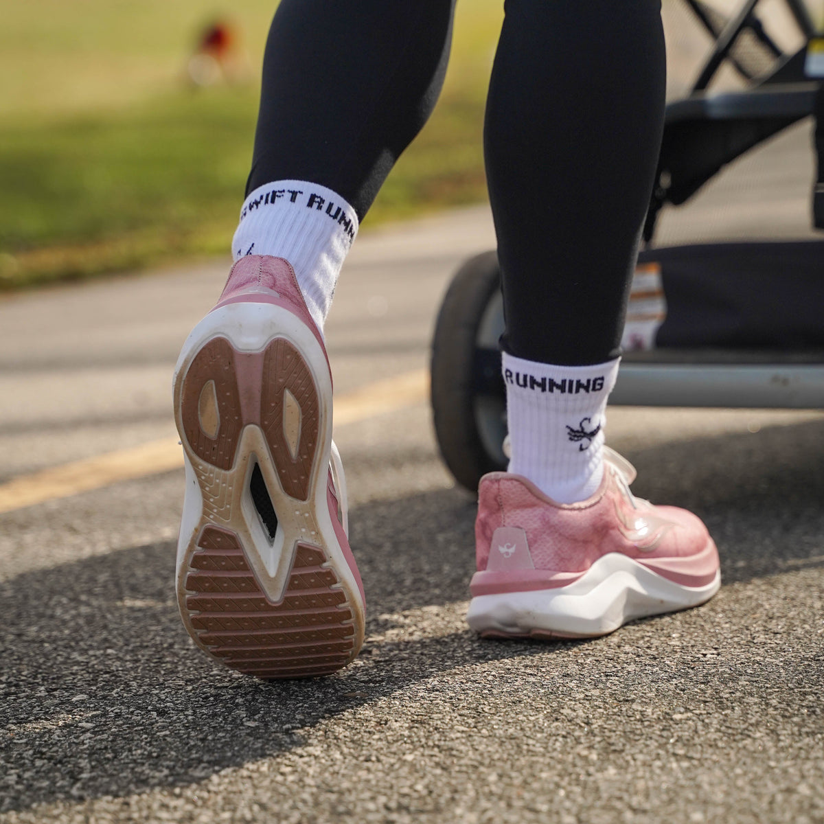 Pink CELER Women athletic shoes by Swift Running, featuring breathable mesh and cushioned soles for comfortable running.