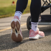 Pink CELER Women athletic shoes by Swift Running, featuring breathable mesh and cushioned soles for comfortable running.