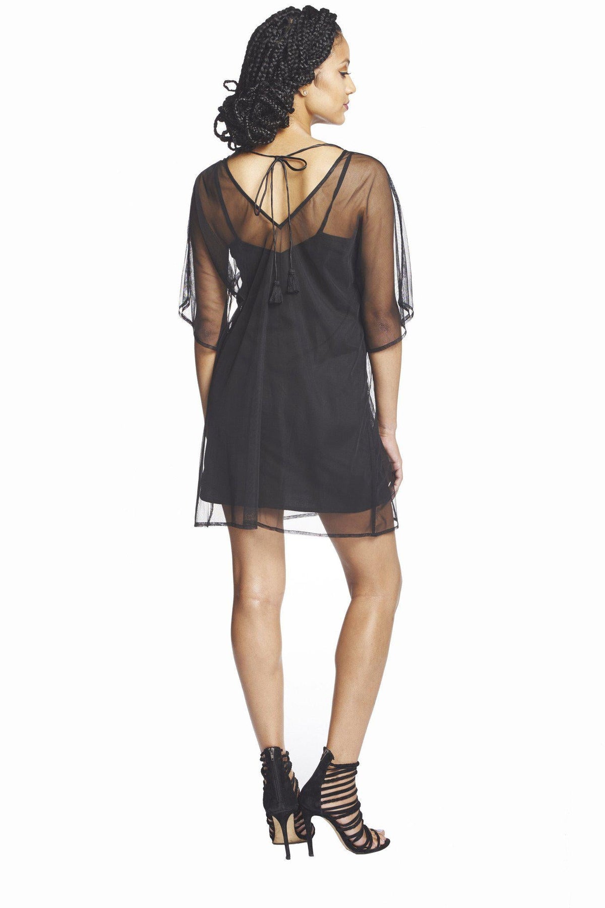 Beaded peacock deep V caftan dress by SymbologyClothing featuring intricate beadwork and vibrant peacock design, flowing fabric.
