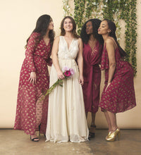 Cream floral embroidered wedding dress with silver accents by SymbologyClothing, featuring intricate floral embroidery and elegant design.