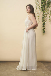 Cream floral embroidered wedding dress with silver accents by SymbologyClothing, featuring intricate embroidery and elegant design.