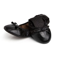 Black Talaria Flats shoes featuring a sleek, premium design with a comfortable flat sole and smooth finish.