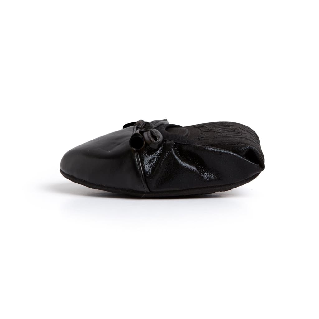Black Talaria Flats shoes with sleek, plain design and comfortable flat soles, perfect for casual or dressy occasions.
