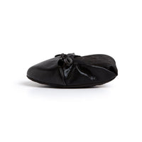 Black Talaria Flats shoes with sleek, plain design and comfortable flat soles, perfect for casual or dressy occasions.