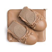 Talaria Flats premium caramel-colored shoes displayed on a neutral background, showcasing the stylish design and smooth leather finish.