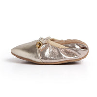 Talaria Flats in Champagne with elegant, flat shoes featuring a sleek design and smooth finish.