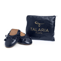 Talaria Flats navy blue shoes with sleek design, featuring comfortable slip-on style and smooth finish.