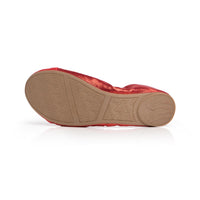 Red Talaria Flats shoes with polished ruby red uppers and comfortable soles, showcasing their stylish and elegant design.