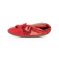 Talaria Flats premium ruby red flats folded, showcasing sleek design and vibrant color perfect for casual or dressy outfits.