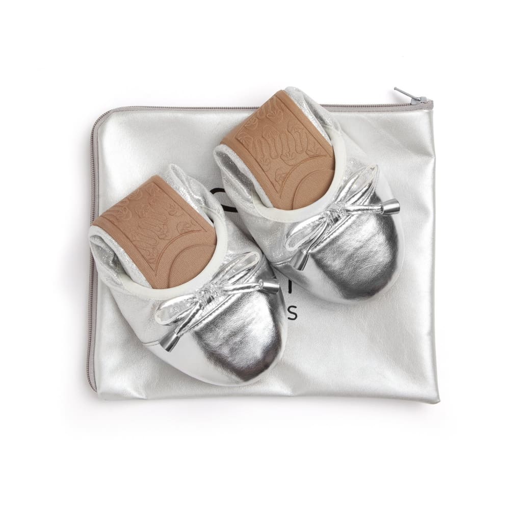 Pair of Talaria Flats silver shoes with sleek design and pointed toes, perfect for casual or dressy occasions.