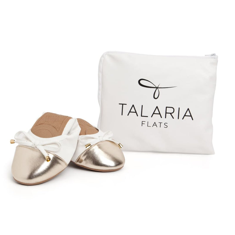 White Talaria Flats shoes with sleek, minimalist design perfect for casual or dressy wear.