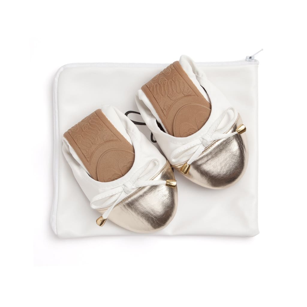 White Talaria Flats shoes with sleek, minimalist design and comfortable flat soles.