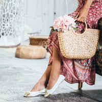White Talaria Flats shoes, premium white flats with sleek design, shown on a clean background.