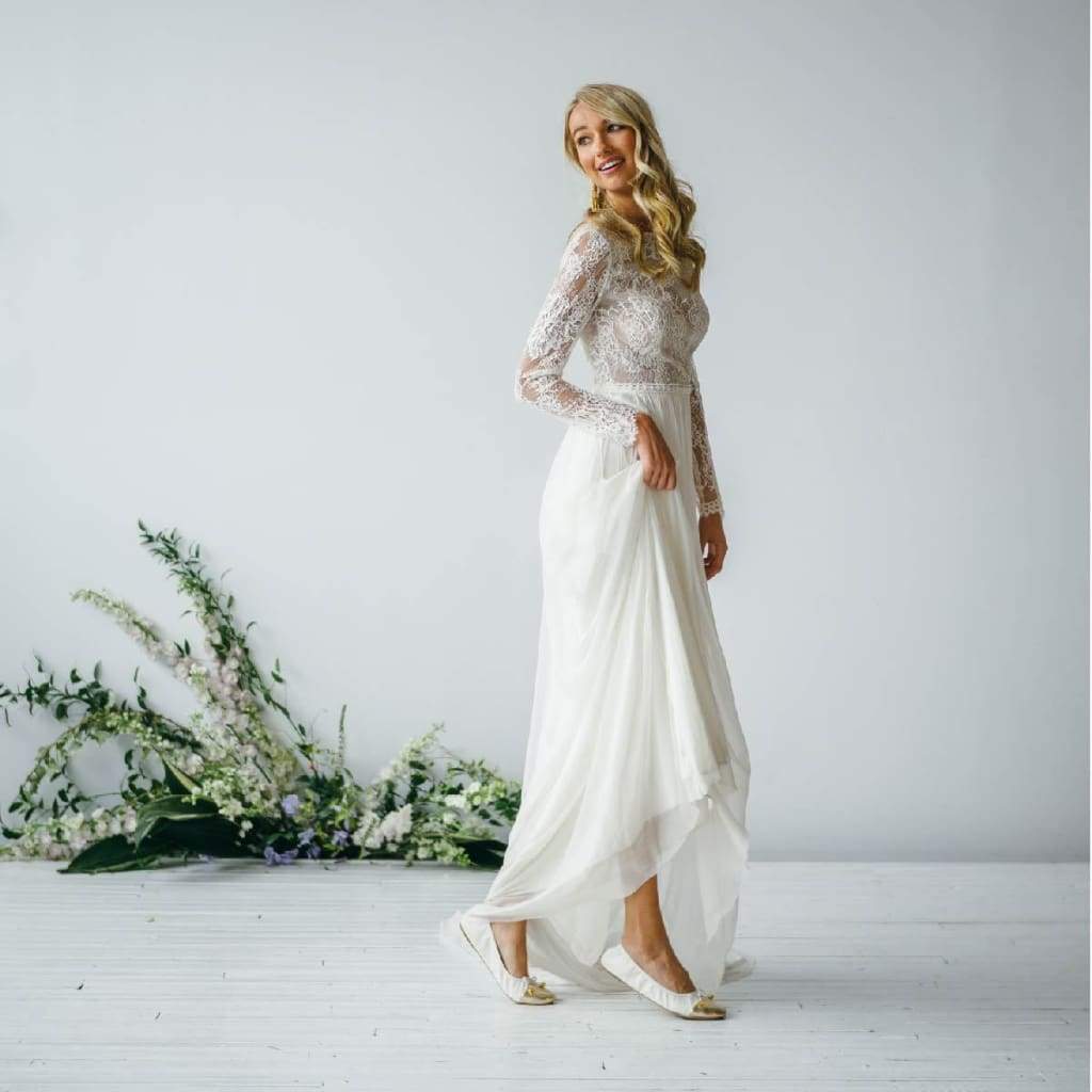 Talaria Flats premium white shoes with sleek design and comfortable fit, featuring smooth white leather and stylish flat soles.