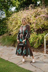 Brown is the New Black teal-colored fabric swatch from Tela Luxury Mercantile, showcasing soft, textured textile material.