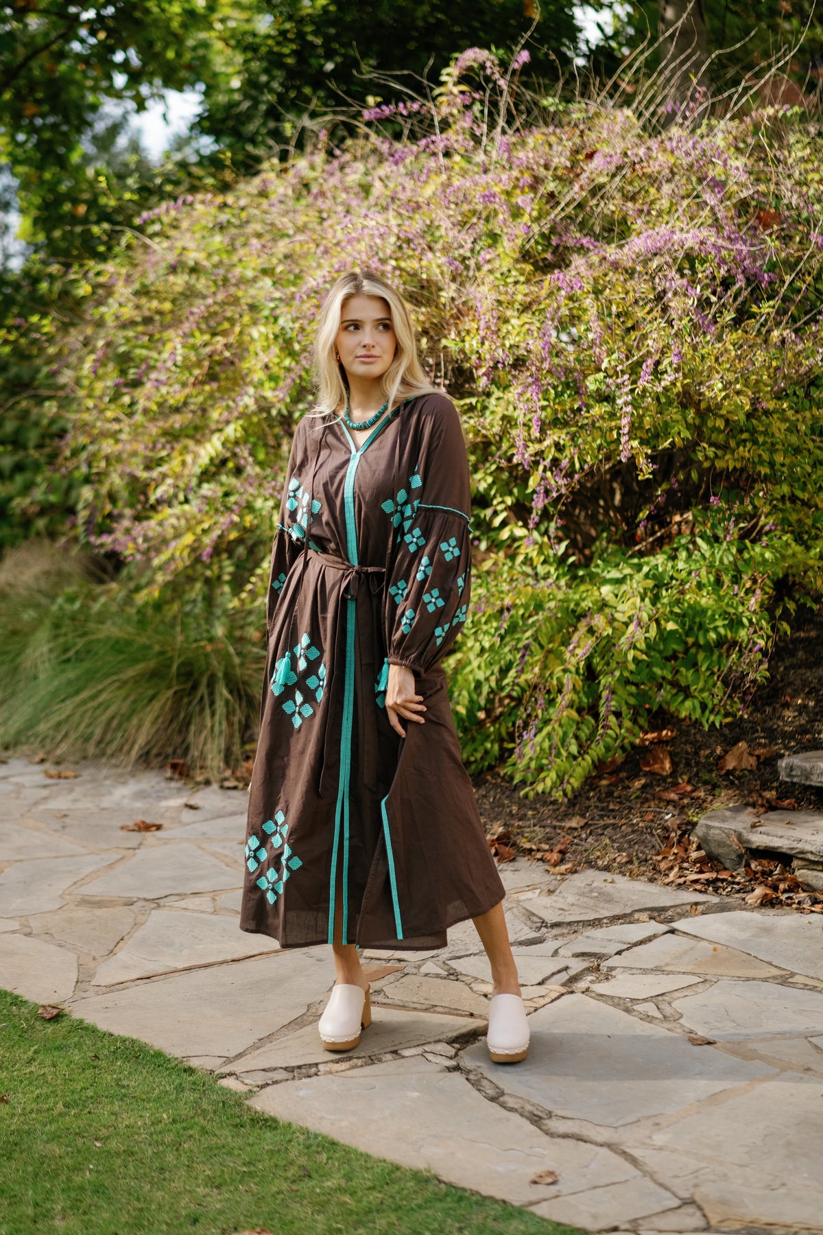 Brown is the New Black teal handbag by Tela Luxury Mercantile featuring smooth leather and elegant design details.