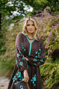 Brown is the New Black teal handbag by Tela Luxury Mercantile, featuring a sleek design and elegant brown and teal color combination.