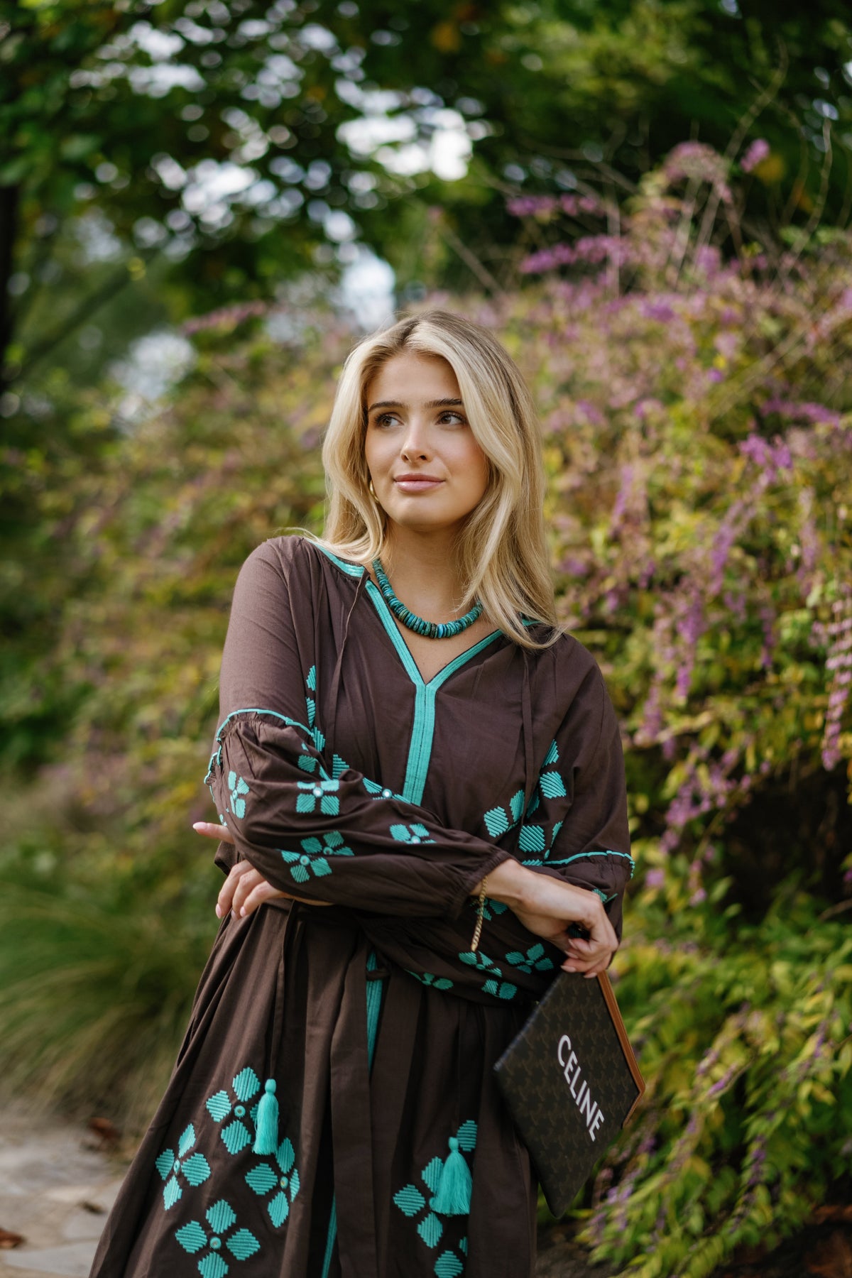 Brown is the New Black teal luxury handbag by Tela Luxury Mercantile with sleek leather finish and elegant design.