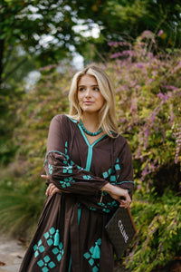 Brown is the New Black teal luxury handbag by Tela Luxury Mercantile with sleek leather finish and elegant design.
