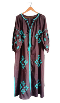 Brown is the New Black teal-colored scarf by Tela Luxury Mercantile, featuring soft fabric and stylish design.