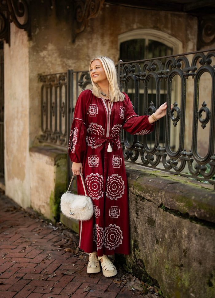 Crimson and white fabric from Tela Luxury Mercantile, showcasing a luxurious textile pattern and rich color contrast.