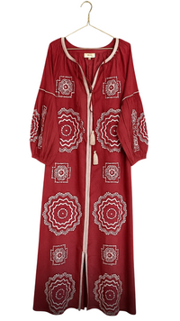Crimson and white Tela Luxury Mercantile fabric swatch displaying vibrant red and white textile pattern.