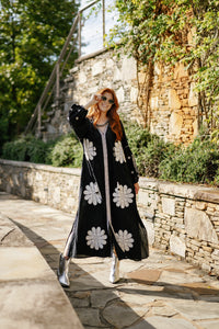 Tela Luxury Mercantile Dawgs Dress displayed on a mannequin, featuring a stylish, patterned design perfect for casual wear.