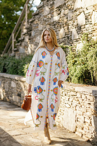 White Fall Funk garment from Tela Luxury Mercantile featuring a stylish, casual design with visible fabric details and modern style.