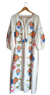 White Fall Funk garment by Tela Luxury Mercantile, featuring stylish design and fabric details in a close-up view.