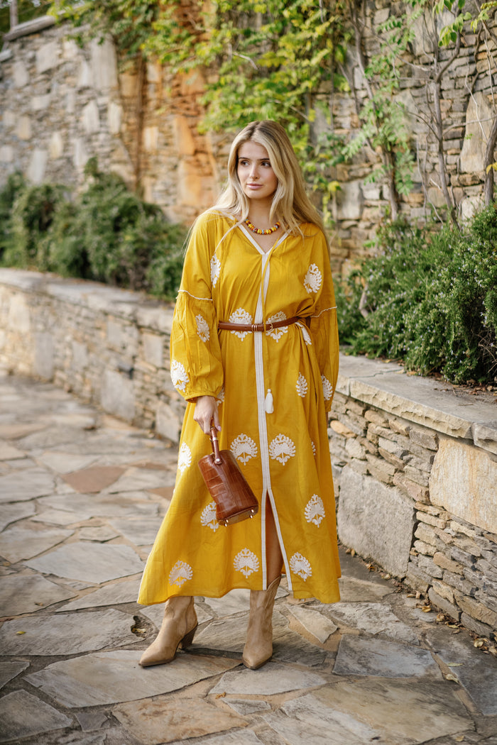 Tela Luxury Mercantile Mellow Yellow fabric swatch showing vibrant yellow textile with soft texture and subtle pattern.